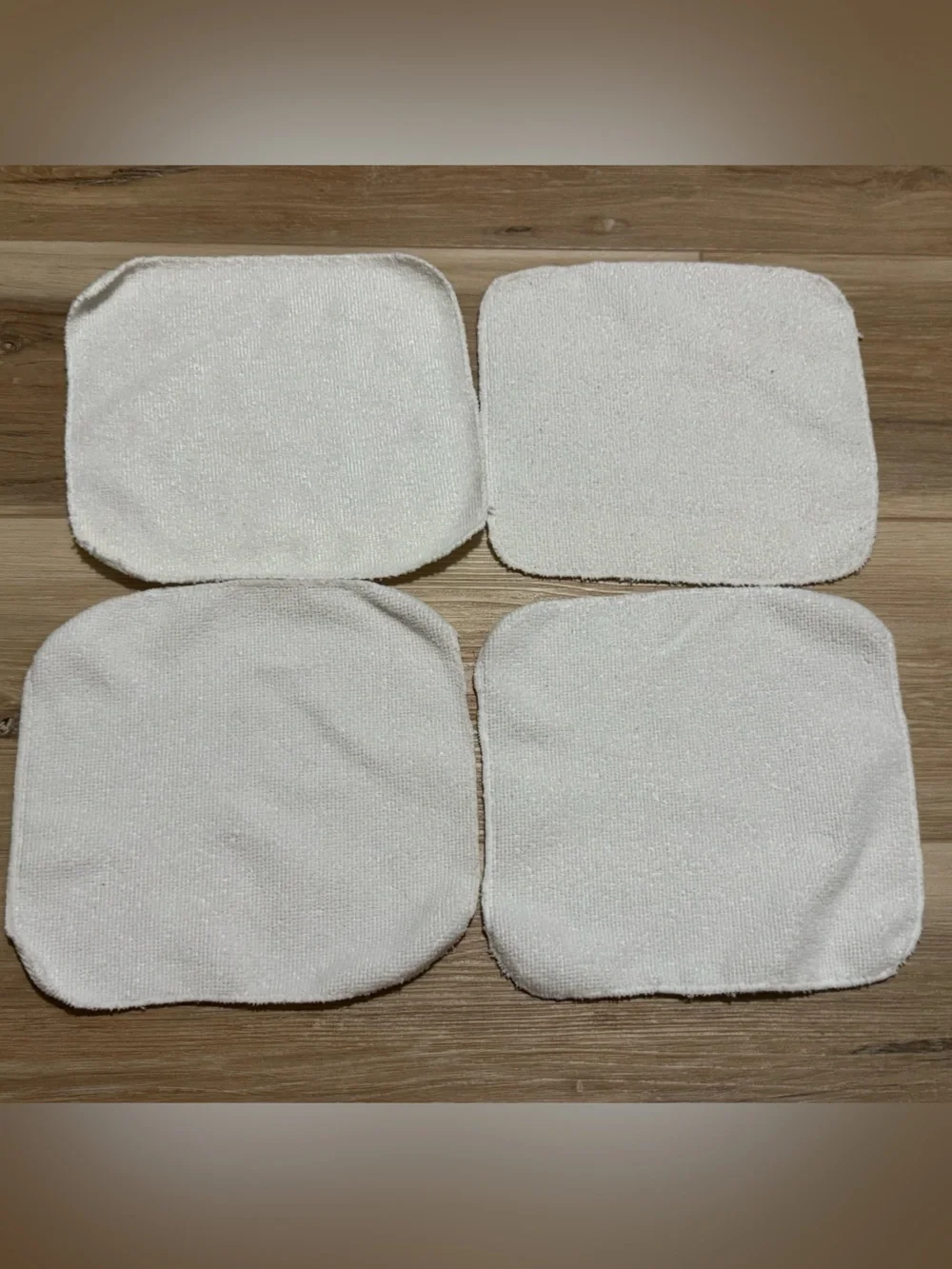 4 White baby wash cloths